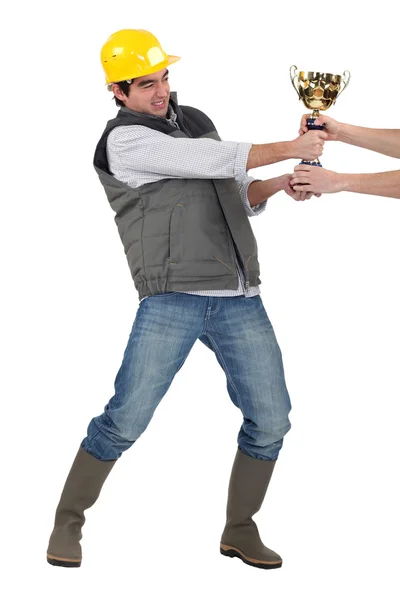 Builder fighting for trophy — Stock Photo, Image