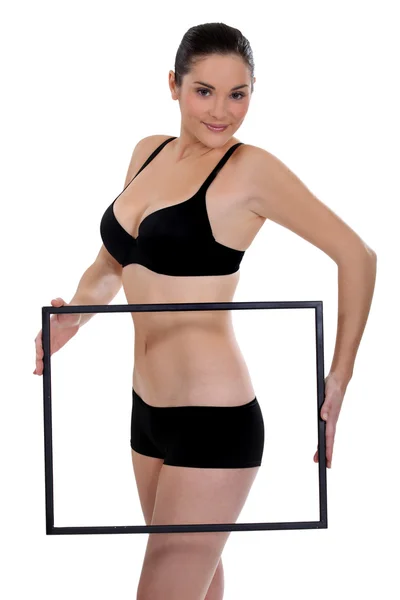 Woman in underwear holding blank picture frame — Stock Photo, Image