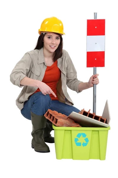 Female construction worker warning you to recycle old material — Stock Photo, Image