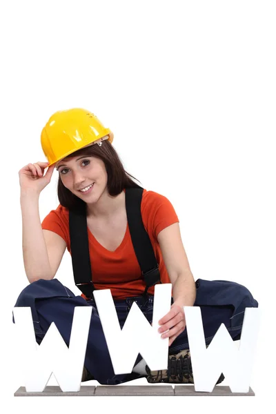 Construction worker with the letters WWW — Stock Photo, Image