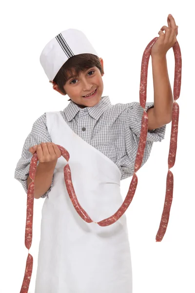 Ребенок с колбасой — стоковое фото