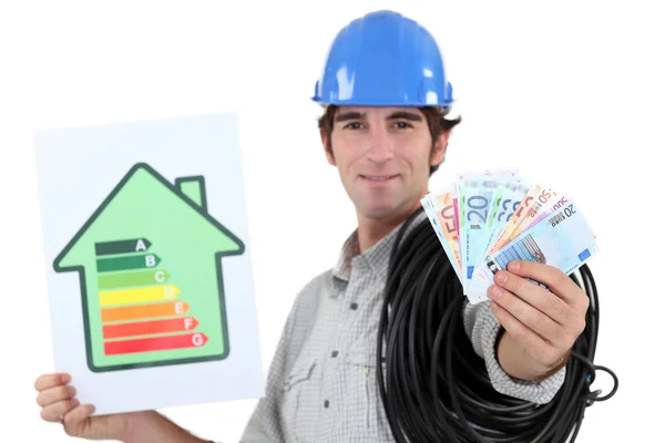 Electrician showing banknotes — Stock Photo, Image