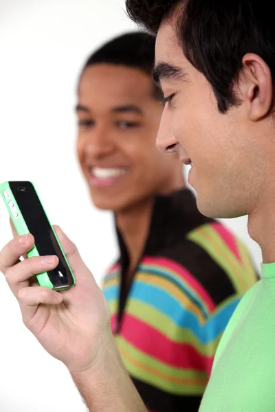 Teen male teenagers looking at text message — Stock Photo, Image