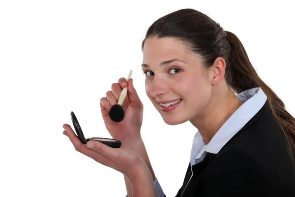 Woman applying blush — Stock Photo, Image