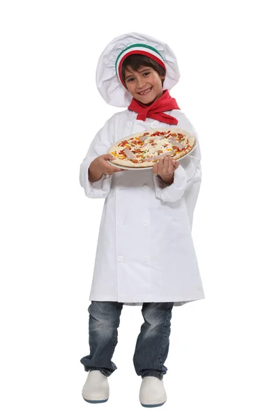 Malý chlapec, oblečený jako pizza kuchař — Stock fotografie