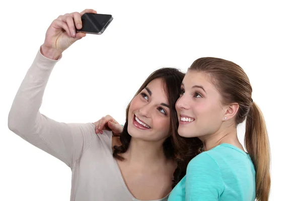 Girls taking pictures of themselves isolated on white — Stock Photo, Image