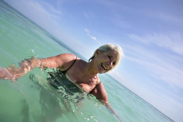 Senior woman in the sea — Stock Photo, Image