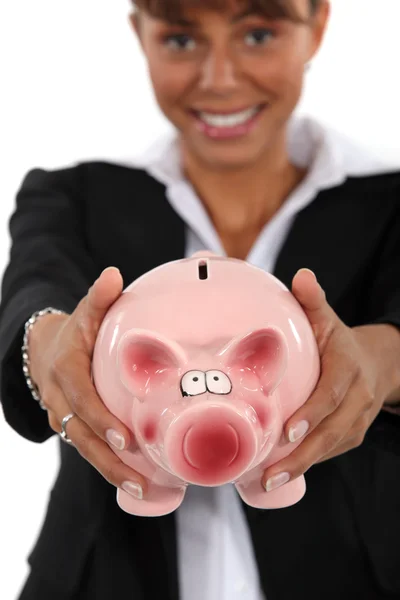 Smart woman with a piggybank — Stock Photo, Image