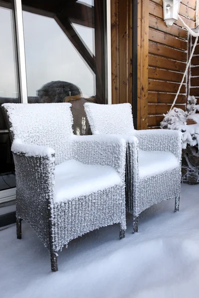 Snow covered chairs — Stock Photo, Image