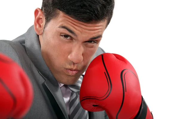 Businessman throwing punches — Stock Photo, Image