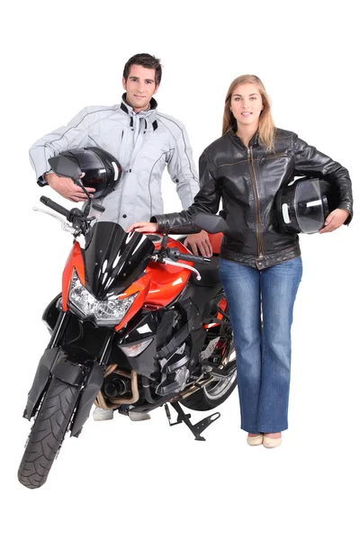 Mężczyzna i kobieta z motocyklem — Zdjęcie stockowe