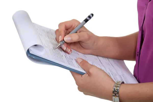 Woman filling in a form — Stock Photo, Image