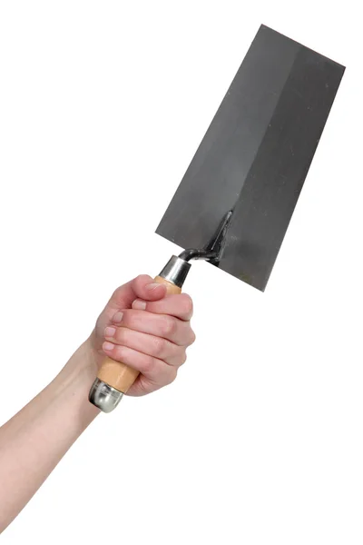 Hand holding a bucket trowel — Stock Photo, Image