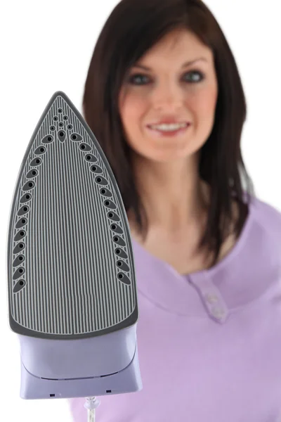 Woman with an iron — Stock Photo, Image