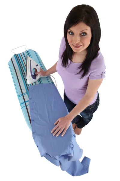 Woman ironing male's shirt — Stock Photo, Image