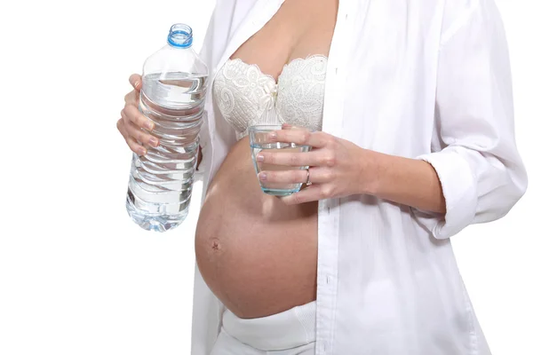 Těhotná žena s lahví vody — Stock fotografie