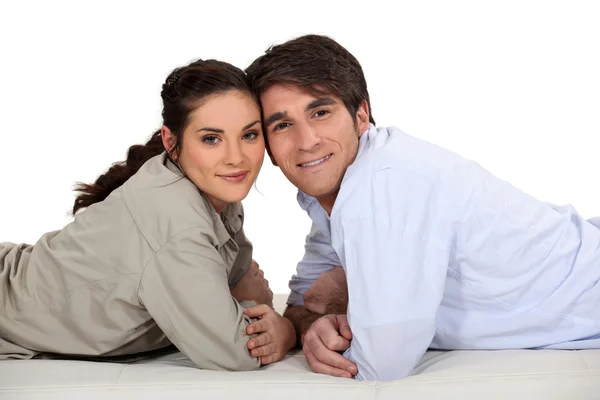 Couple laying on their fronts — Stock Photo, Image