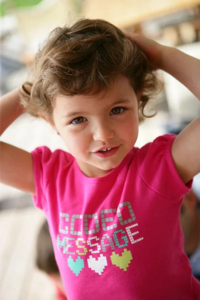 Little girl in a pink t-shirt — Stock Photo, Image