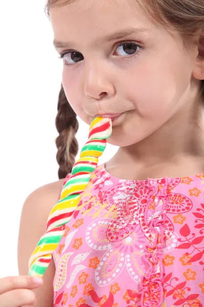 Chica chupando lolly pop — Foto de Stock