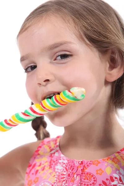Cute kid with a swirly lolly — Stock Photo, Image