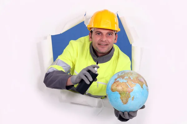 Man with aerosol and globe — Stock Photo, Image