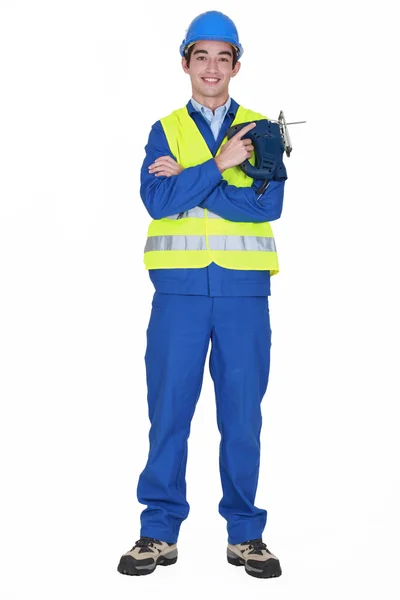 Construction worker with a jigsaw — Stock Photo, Image