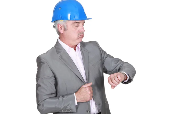 Architect looking at his watch — Stock Photo, Image