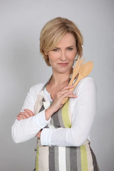 Woman with wooden cutlery — Stock Photo, Image