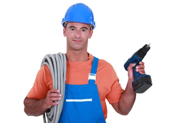 Electrician with wiring and cordless drill — Stock Photo, Image