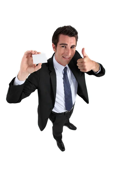 Affärsman hålla kortet och gör ok gest — Stockfoto