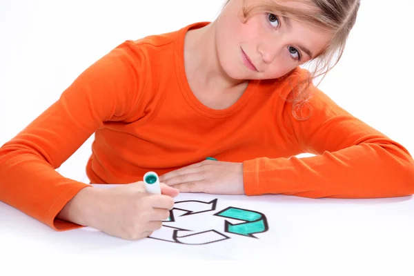 Girl colouring recycling sign — Stock Photo, Image