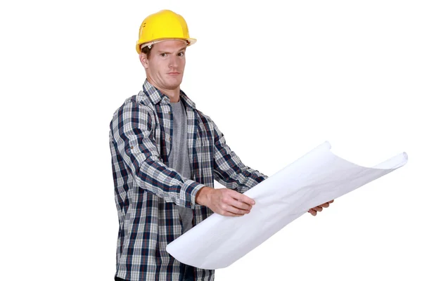 Young foreman with blueprints isolated on white — Stock Photo, Image