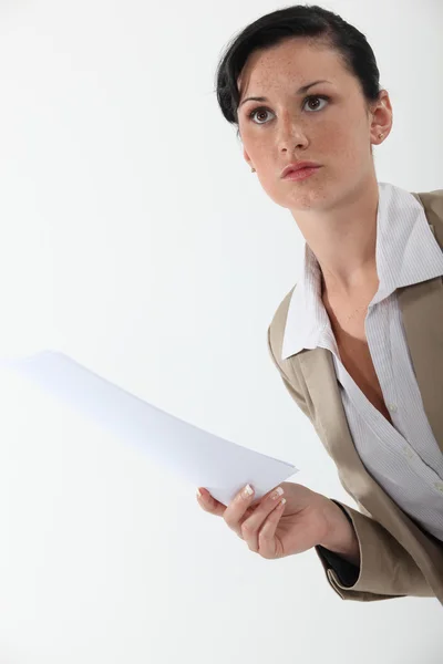 Woman with paper in hand — Stock Photo, Image