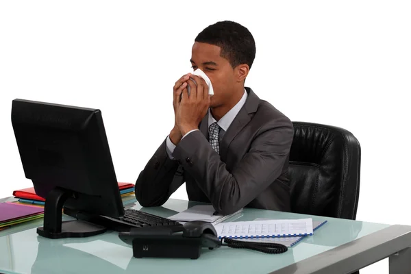 Businessman blowing his nose — Stock Photo, Image