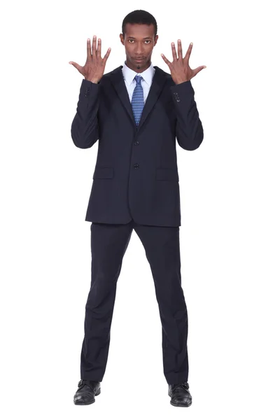 Studio shot of a business man with his hands in the air — Stock Photo, Image