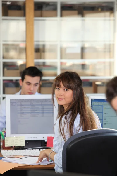 Woman in an open plan office — Stock Photo, Image