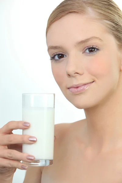 Woman holding glass of fresh milk Royalty Free Stock Photos