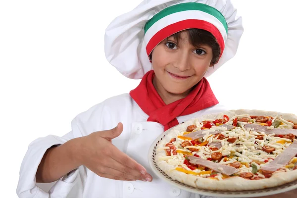 Child cook pizza Stock Image