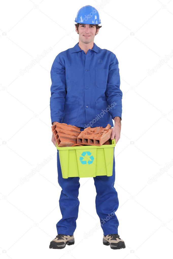 Workers with bricks for recycling