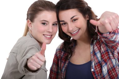 Young women giving the thumb's up clipart