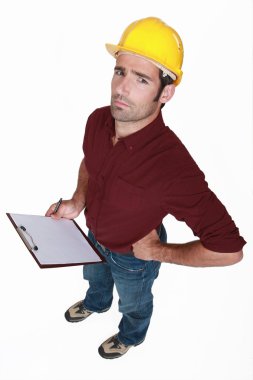 Distrustful tradesman with a clipboard clipart