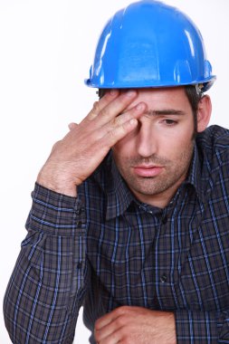 Engineer with a headache clipart