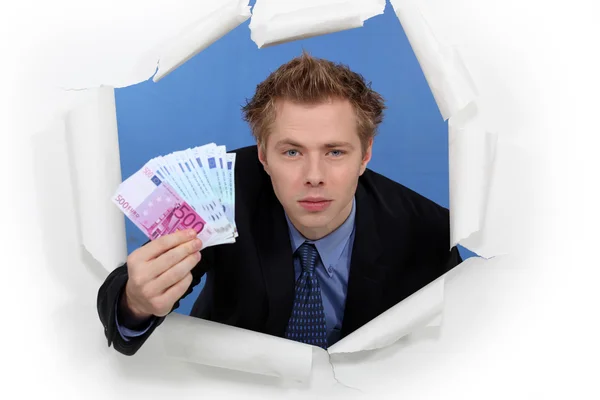 An arrogant businessman successfully breaking into a market — Stock Photo, Image