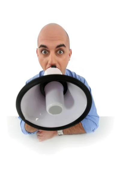 Bald man shouting into megaphone — Stock Photo, Image