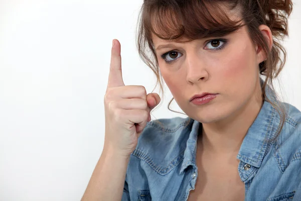 Stern woman pointing finger — Stock Photo, Image