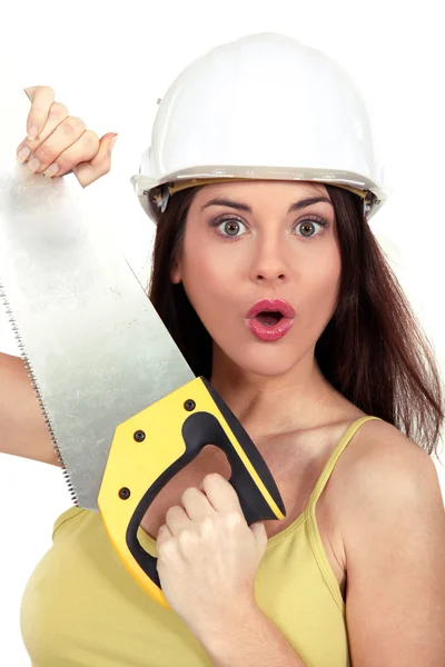 Surprised woman with a handsaw — Stock Photo, Image