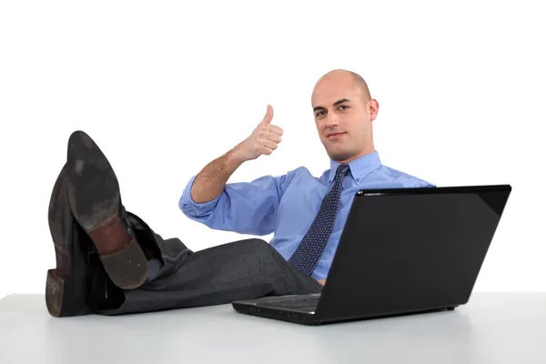 Man with feet on the table — Stock Photo, Image