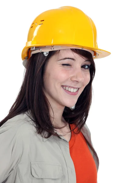 Wink de uma trabalhadora de construção feminina — Fotografia de Stock