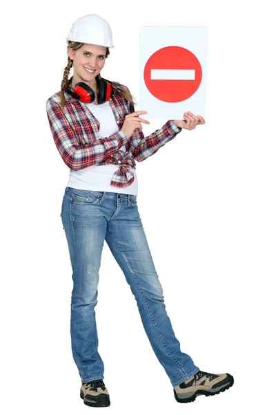 A female holding a wrong way sign. — Stock Photo, Image