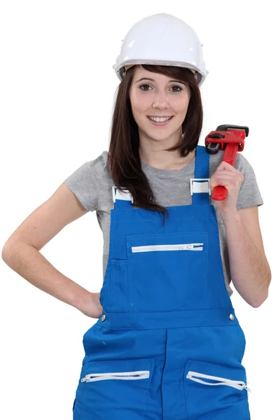 Happy female worker holding wrench — Stock Photo, Image
